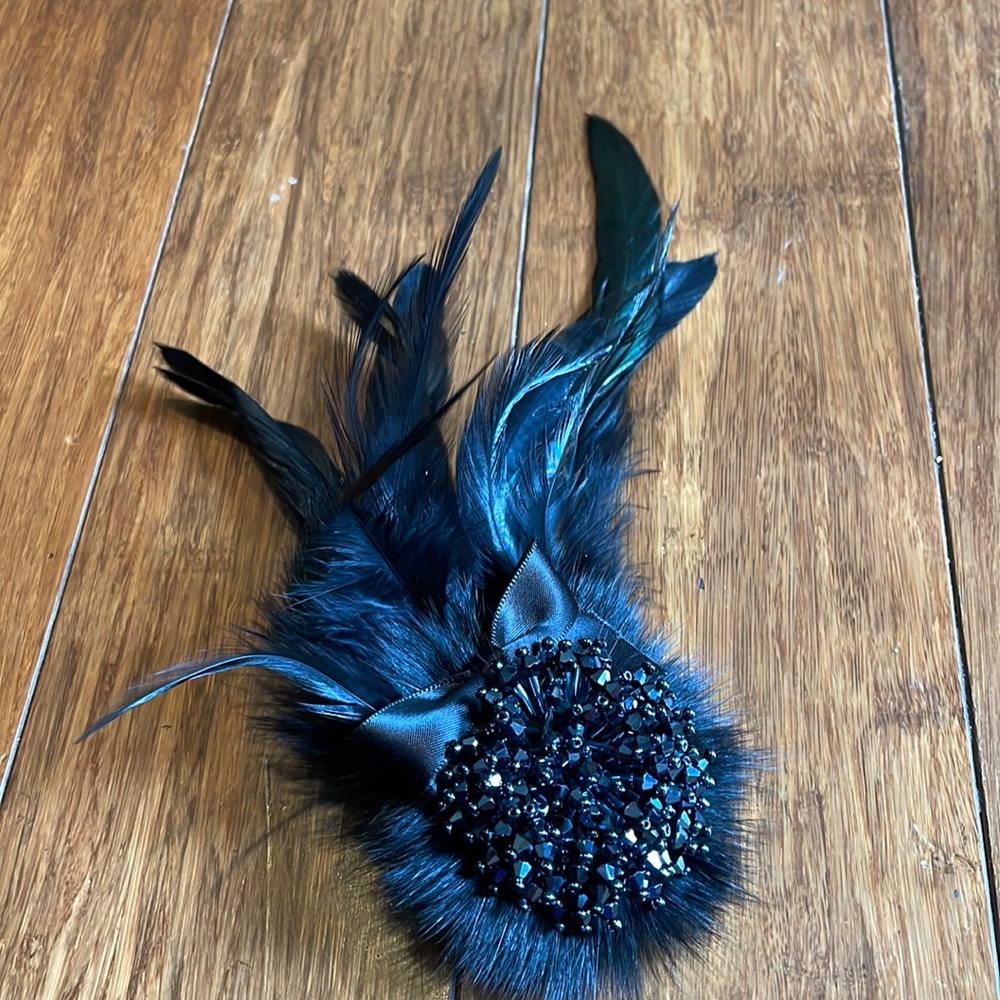 Black beaded and feather brooch